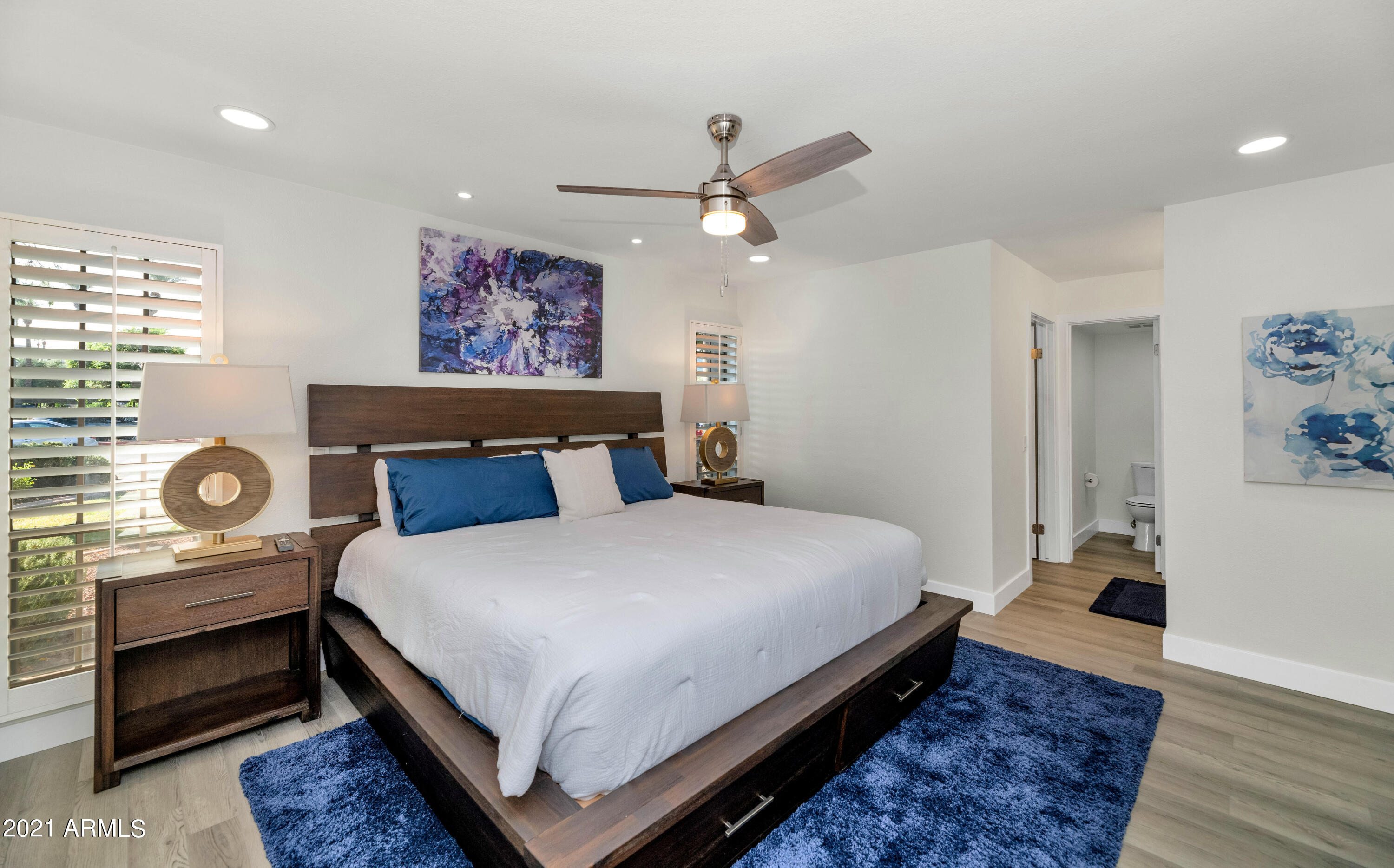 5221 North 24th Street, Unit 106 Phoenix, AZ 85016 - Photo 8 of 20 a bedroom with a bed and painting on the wall