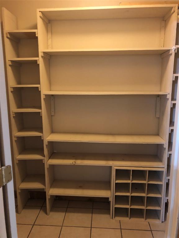 210 Jones Road Graford, TX 76449 - Photo 12 of 25 a view of walk in closet with empty racks