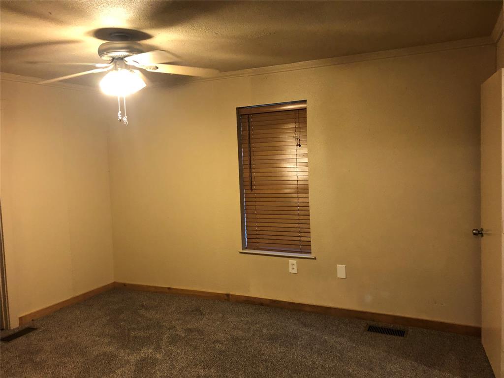 210 Jones Road Graford, TX 76449 - Photo 15 of 25 a view of an empty room with a window