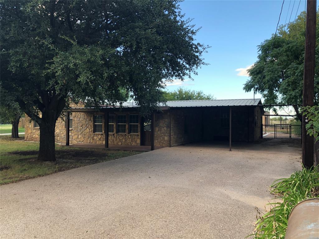 210 Jones Road Graford, TX 76449 - Photo 2 of 25 a front view of a house with a garage