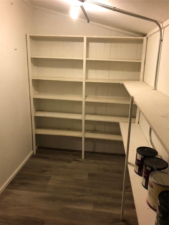 210 Jones Road Graford, TX 76449 - Photo 21 of 25 a view of walk in closet with empty racks