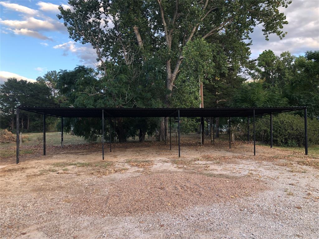 210 Jones Road Graford, TX 76449 - Photo 24 of 25 a backyard of a house with lots of green space