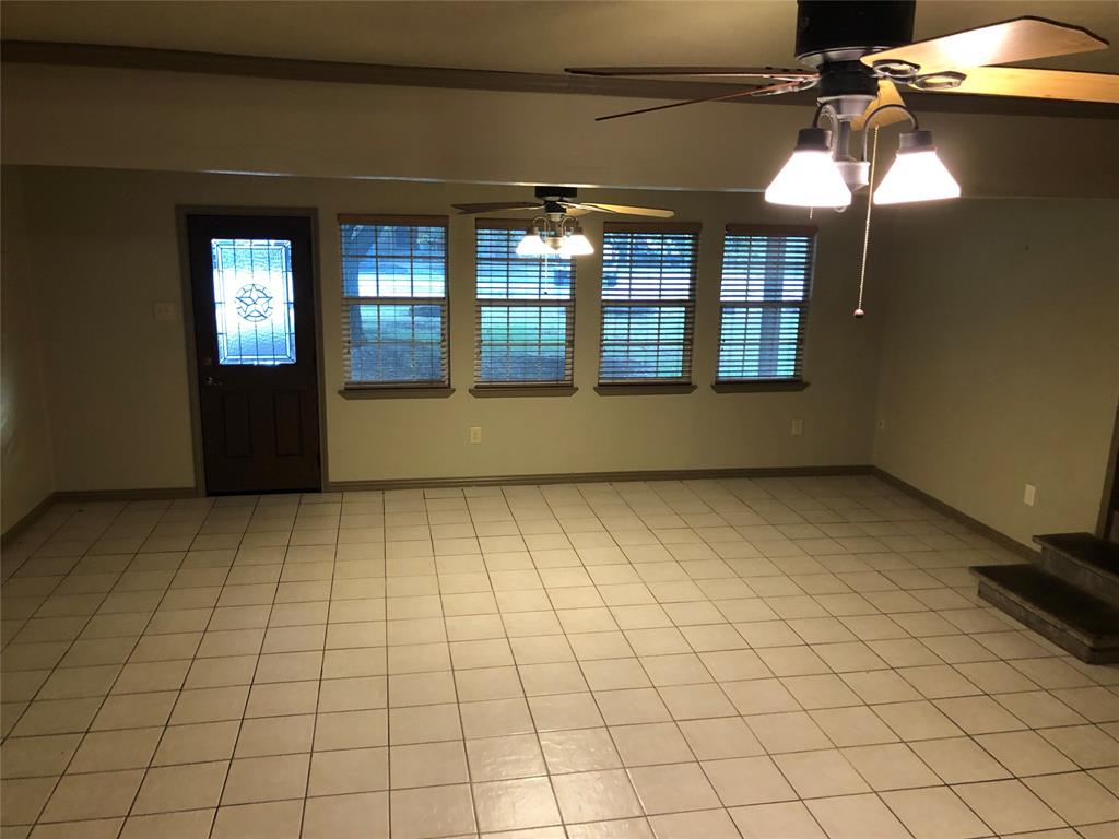 210 Jones Road Graford, TX 76449 - Photo 3 of 25 a view of an empty room with a window