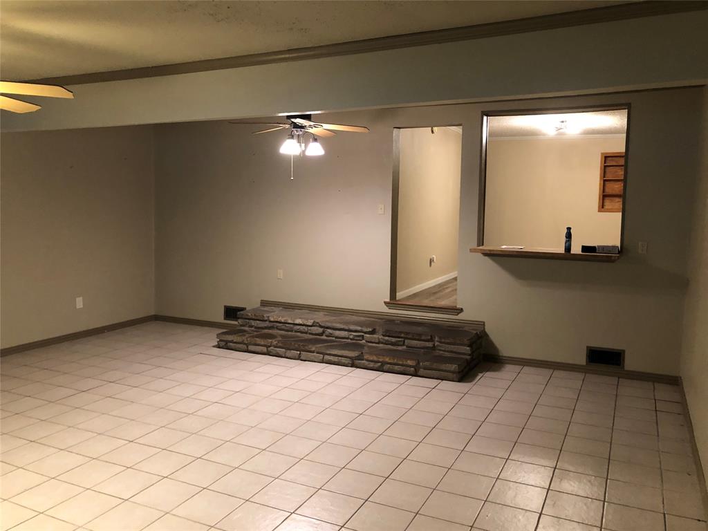 210 Jones Road Graford, TX 76449 - Photo 5 of 25 a room with a mirror and a sink