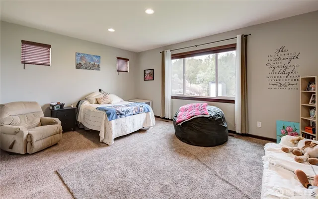 a bedroom with a bed and a couch