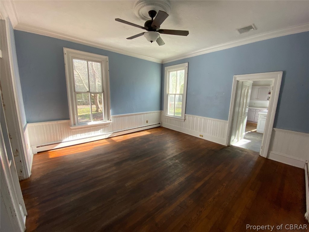 11044 Buckley Hall Road Mathews, VA 23109 - Photo 10 of 34 a view of an empty room with wooden floor and a window