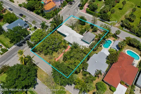 an aerial view of house with a yard