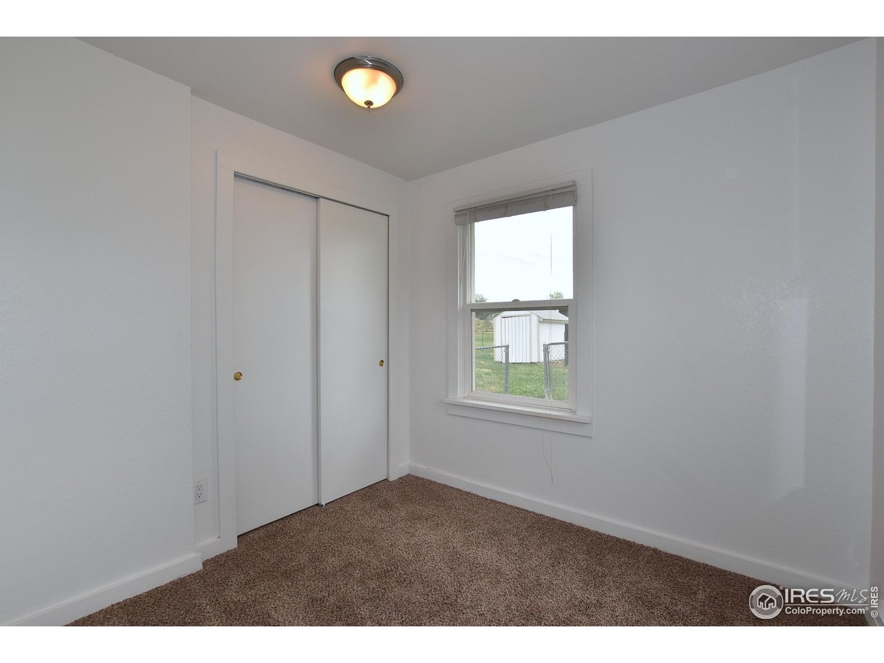 1340 North Taft Hill Road Fort Collins, CO 80521 - Photo 28 of 40 a view of an empty room with a window