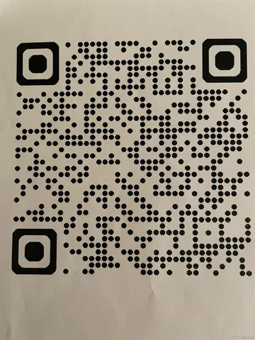 a bathroom with a black and white checkered floor