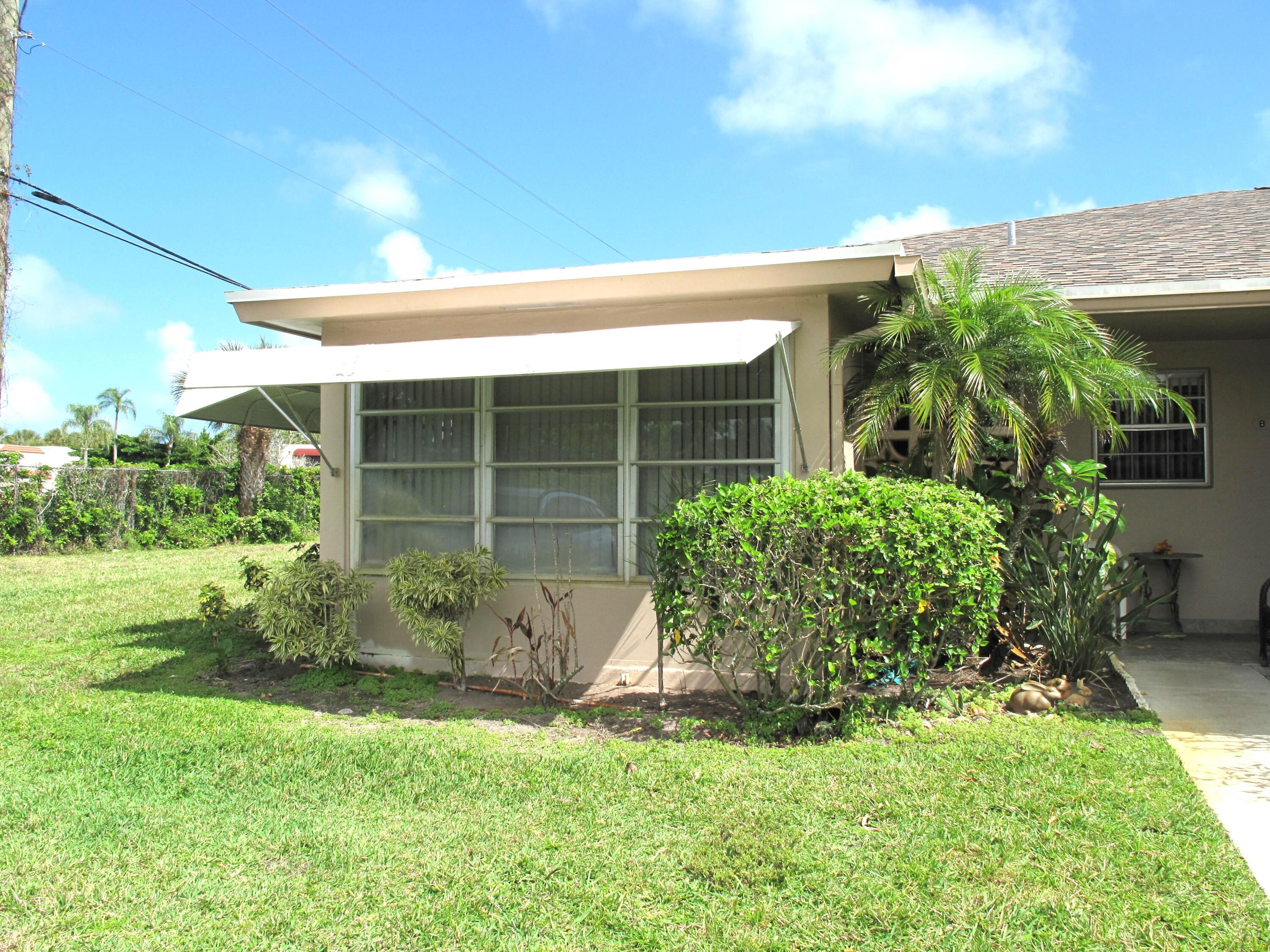 1295 High Point Place North, Unit A Delray Beach, FL 33445 - Photo 1 of 42 Front view of corner villa