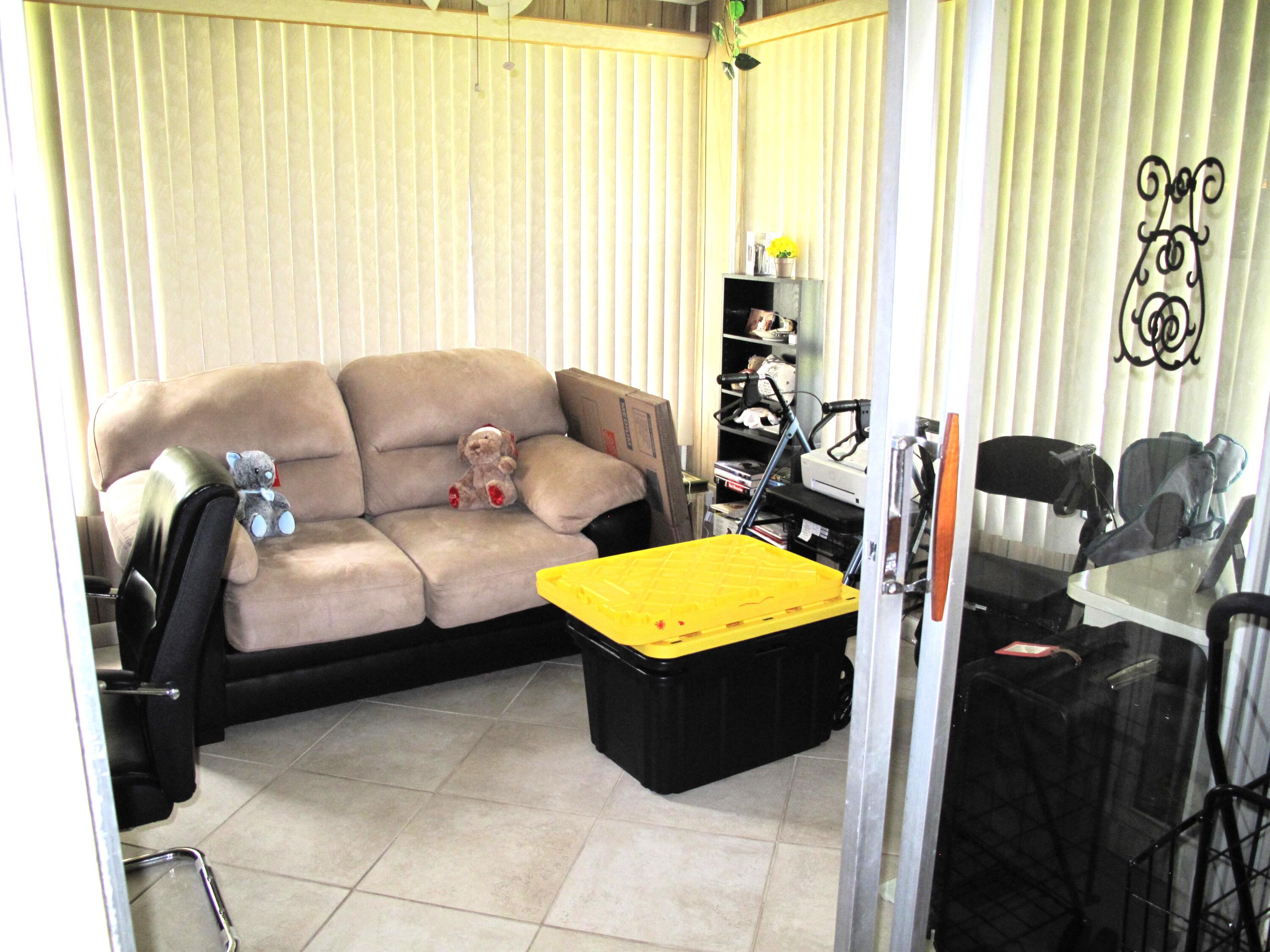 1295 High Point Place North, Unit A Delray Beach, FL 33445 - Photo 2 of 42 Enclosed Florida room (1)