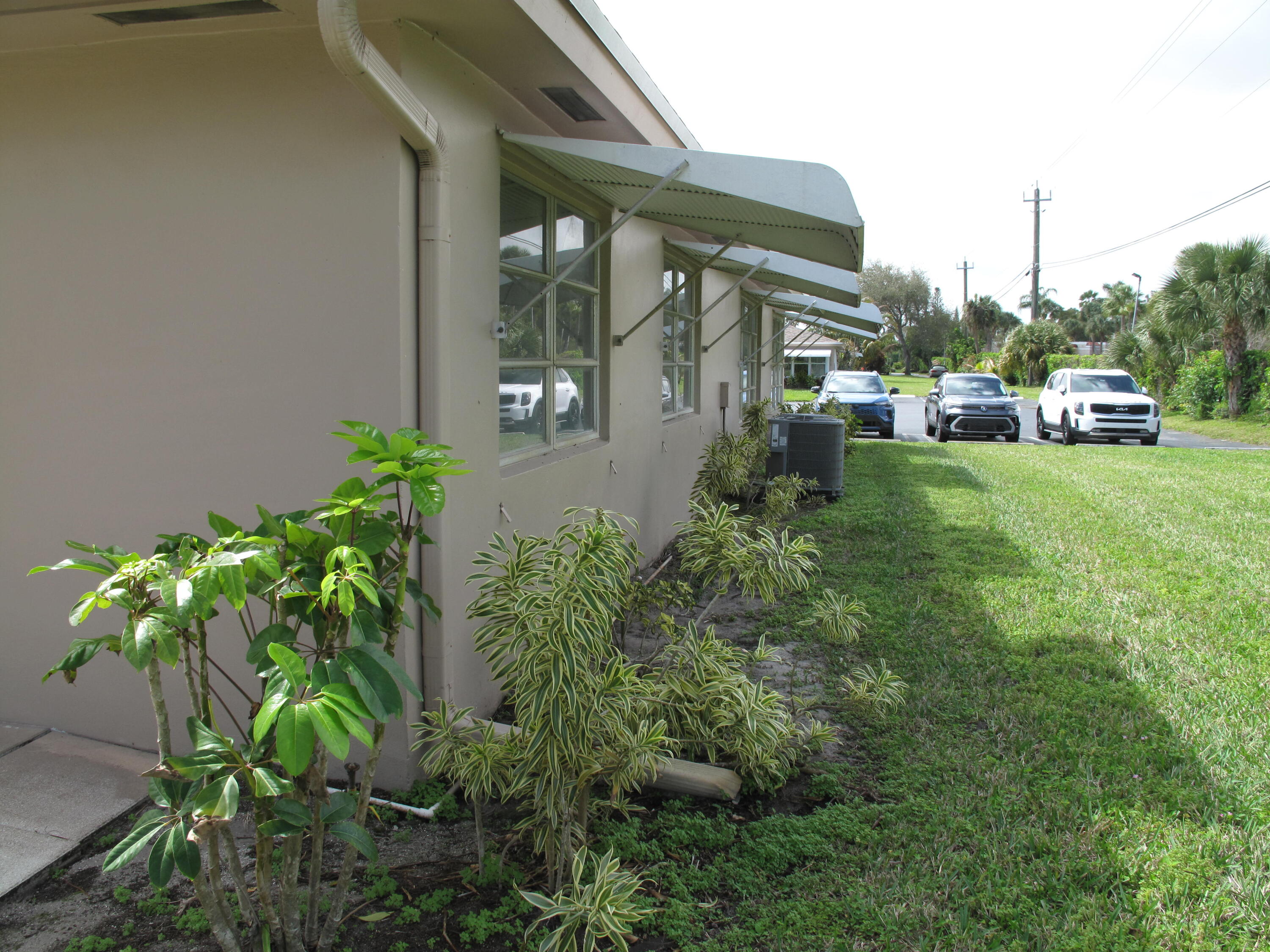 1295 High Point Place North, Unit A Delray Beach, FL 33445 - Photo 25 of 42 Side view of villa and private yard