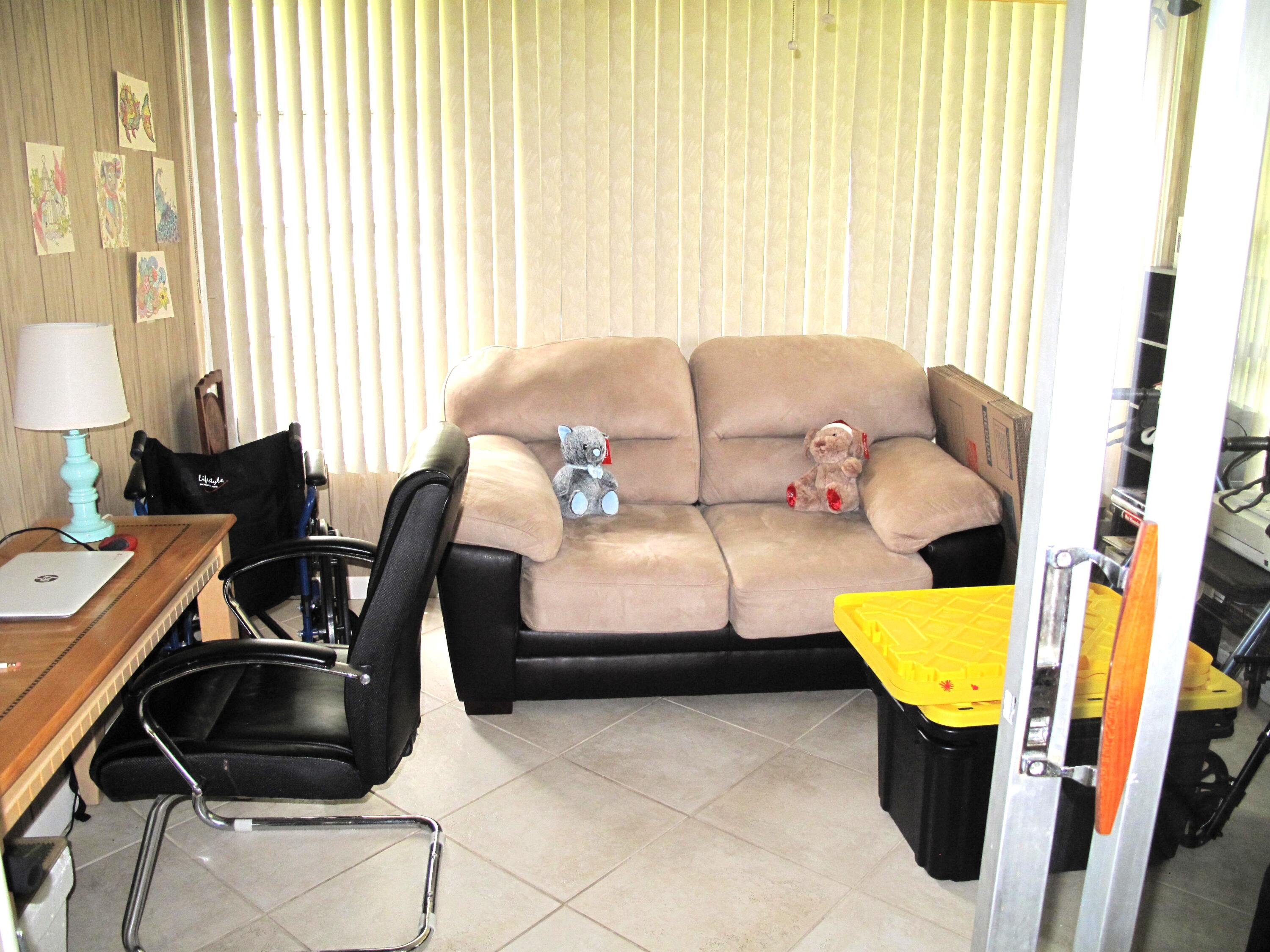 1295 High Point Place North, Unit A Delray Beach, FL 33445 - Photo 3 of 42 Enclosed Florida room (2)