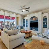 a living room with furniture kitchen view and a fireplace