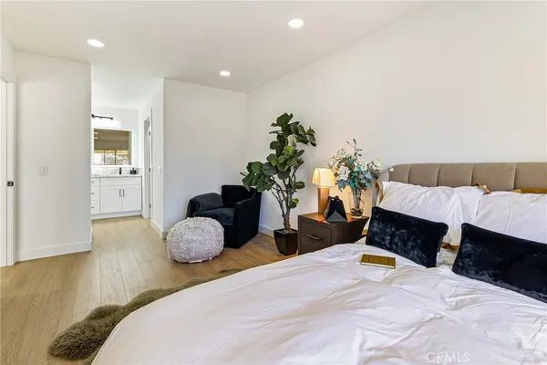 a bedroom with a bed and a couch