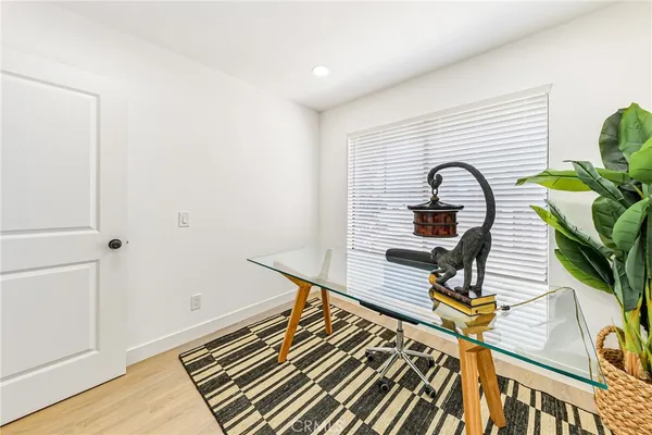 a picture of a living room with wooden floor