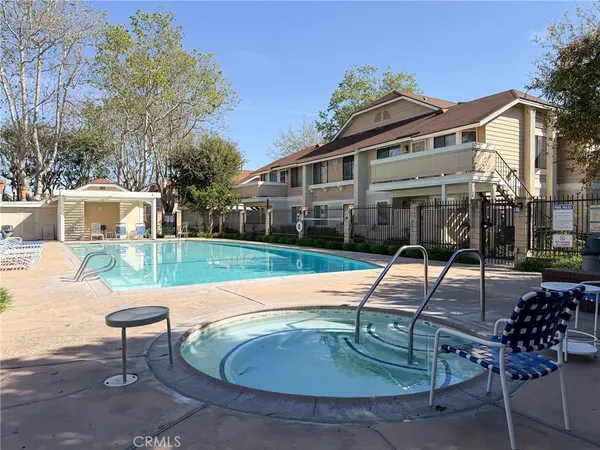 a view of a house with backyard porch and sitting area