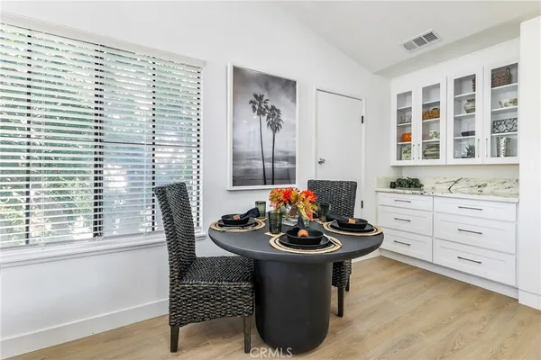 a dining room with furniture and window