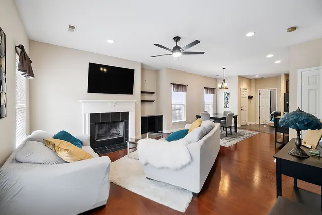 a living room with furniture fireplace and a flat screen tv