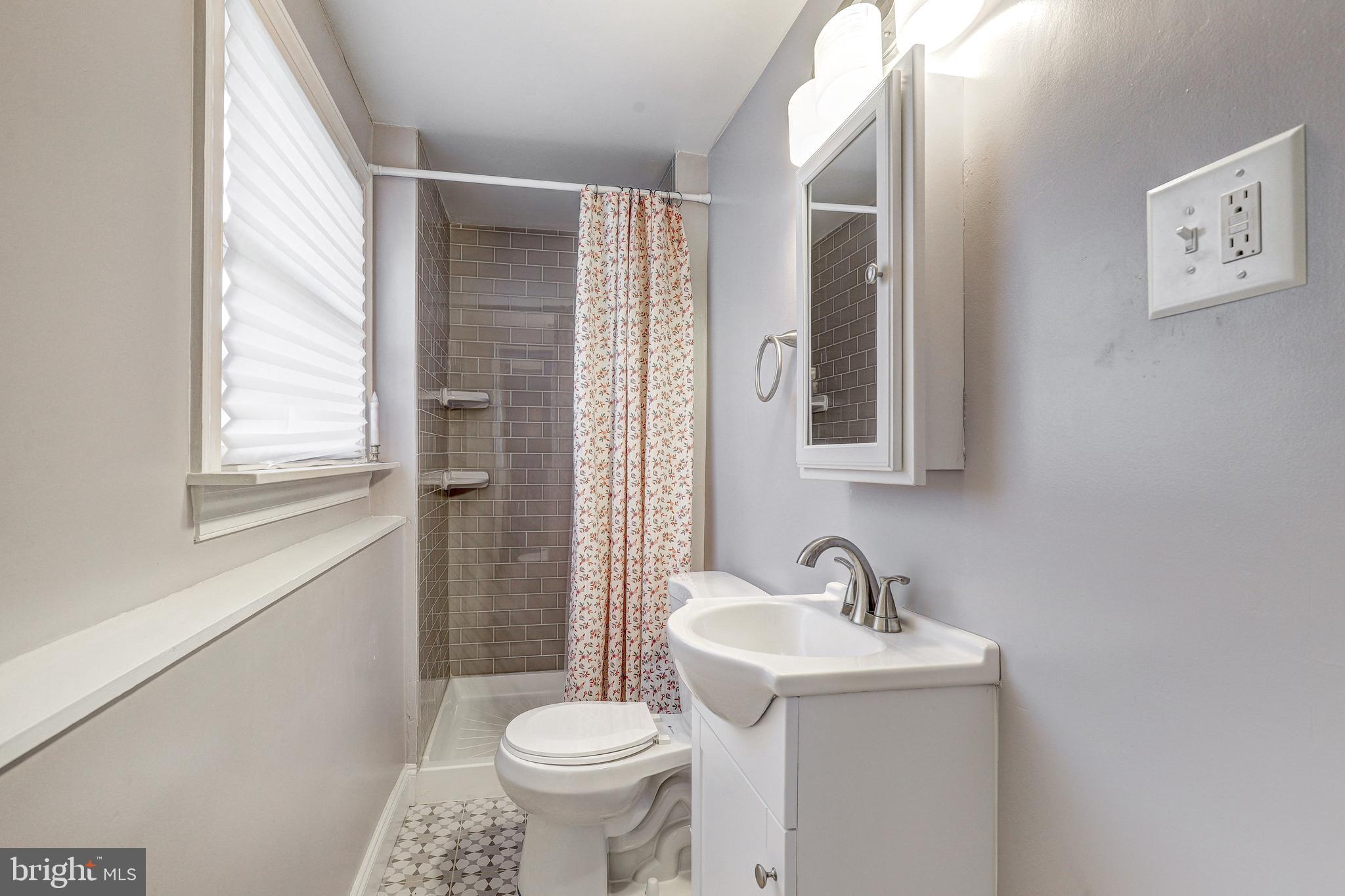 228 Quaker Ridge Road Lutherville-Timonium, MD 21093 - Photo 15 of 26 a bathroom with a sink and a toilet