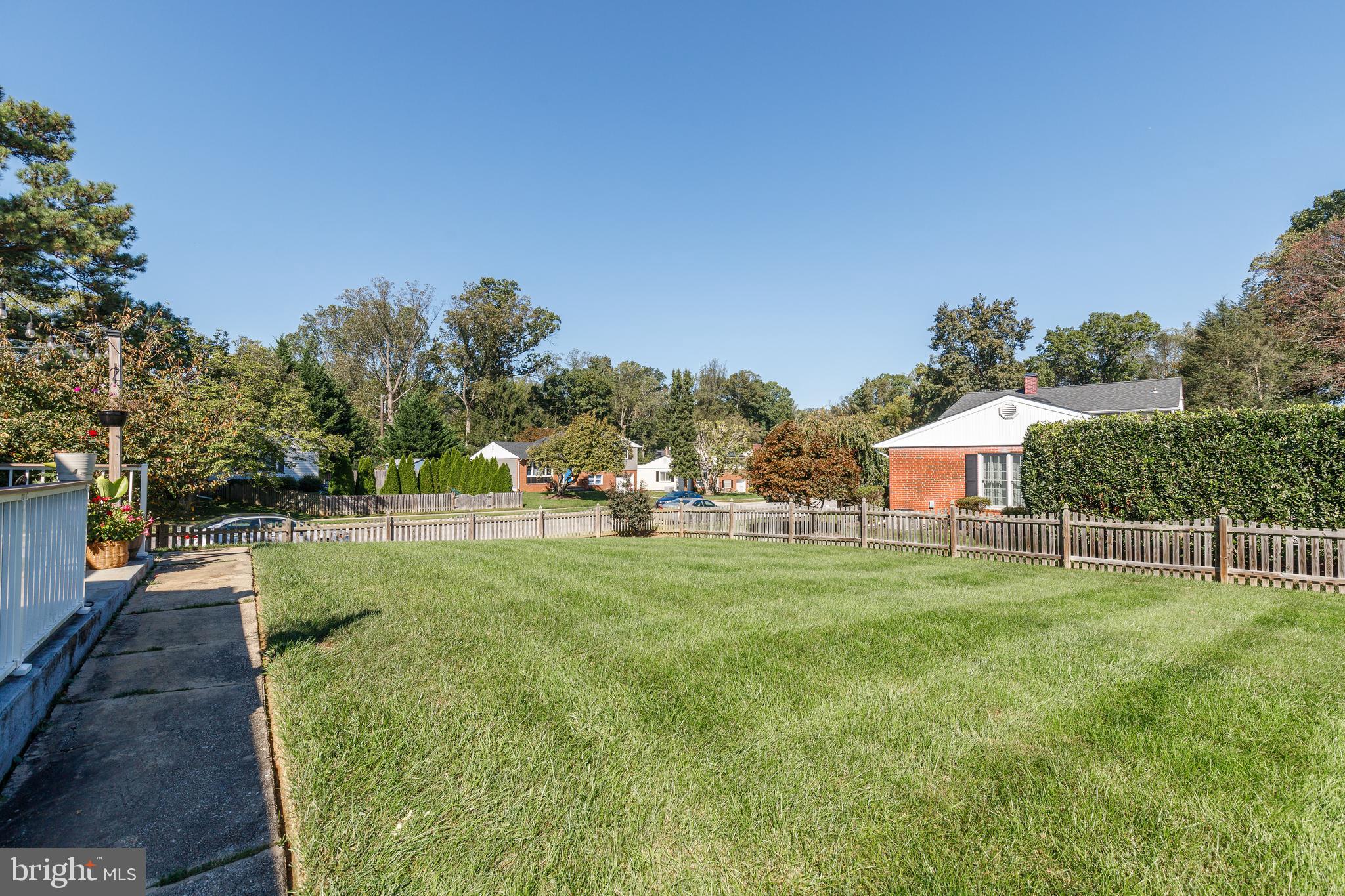 228 Quaker Ridge Road Lutherville-Timonium, MD 21093 - Photo 20 of 26 a backyard of a house with table and chairs