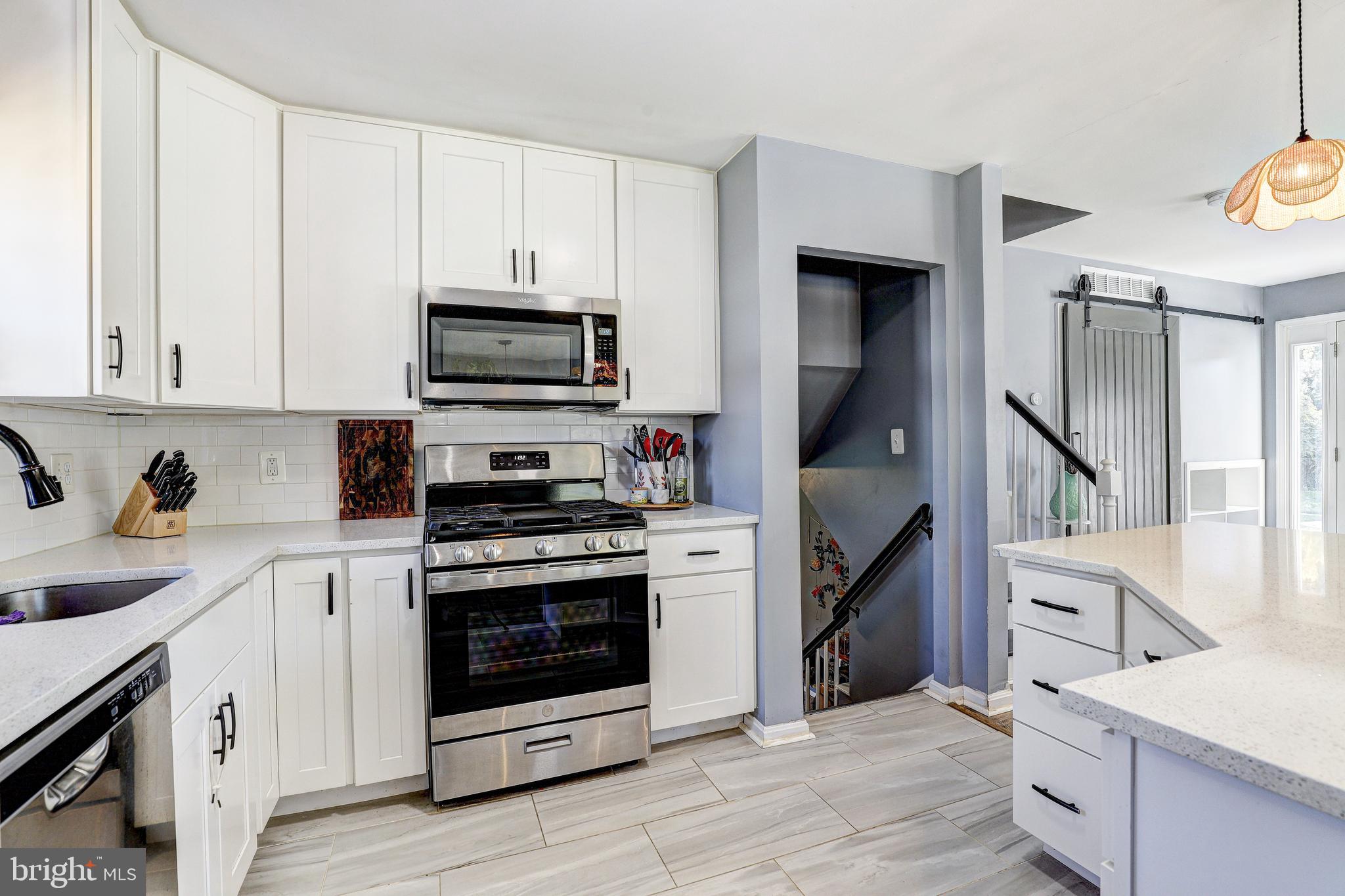 228 Quaker Ridge Road Lutherville-Timonium, MD 21093 - Photo 9 of 26 a kitchen with a stove and a sink
