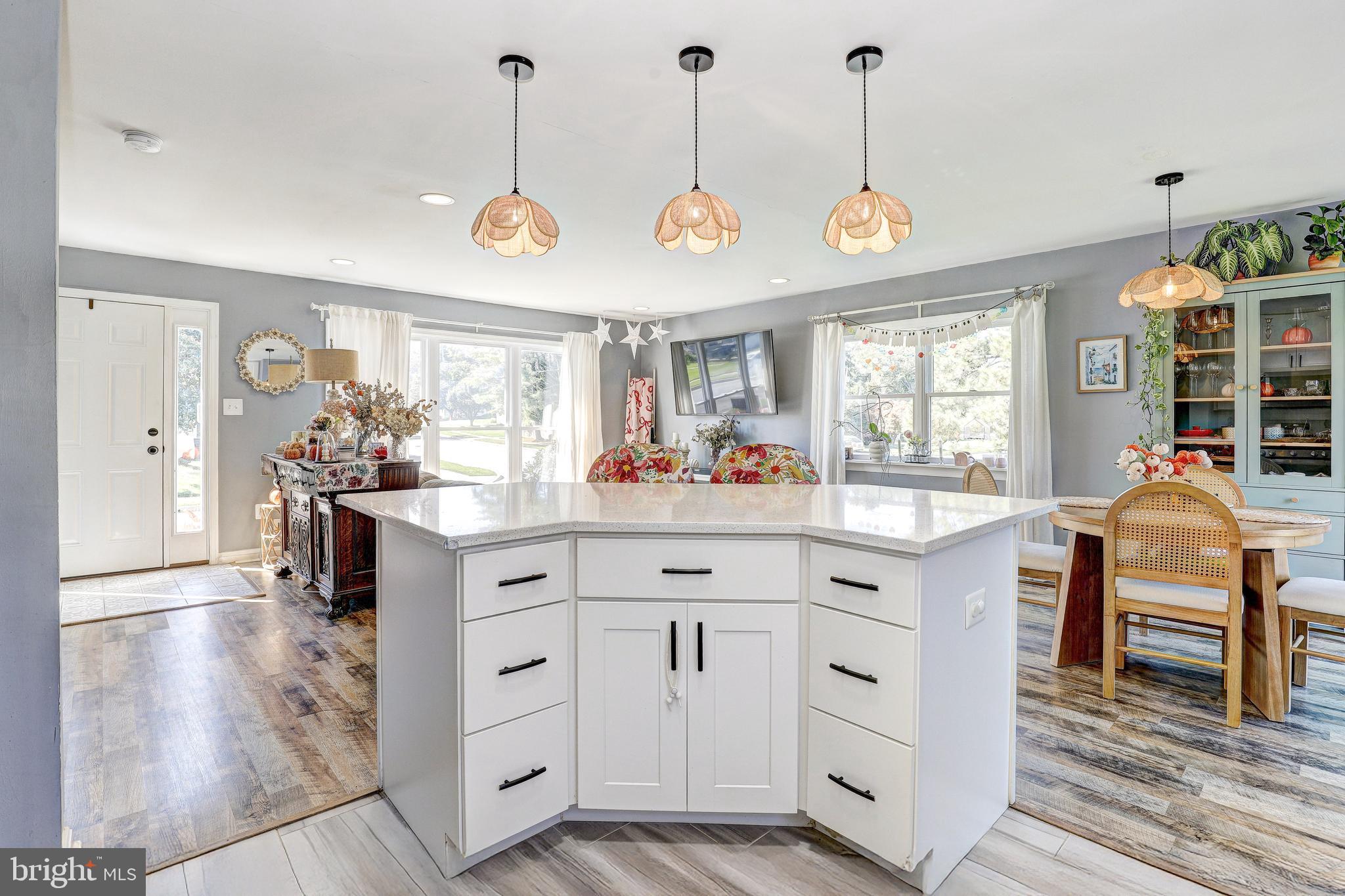 228 Quaker Ridge Road Lutherville-Timonium, MD 21093 - Photo 10 of 26 a hall with white cabinets and chandelier