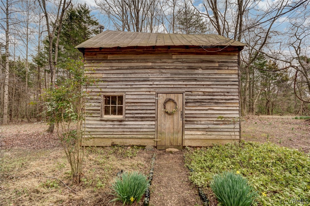 4625 Walton Road Louisa, VA 23093 - Photo 13 of 50 a front view of a house with a garden