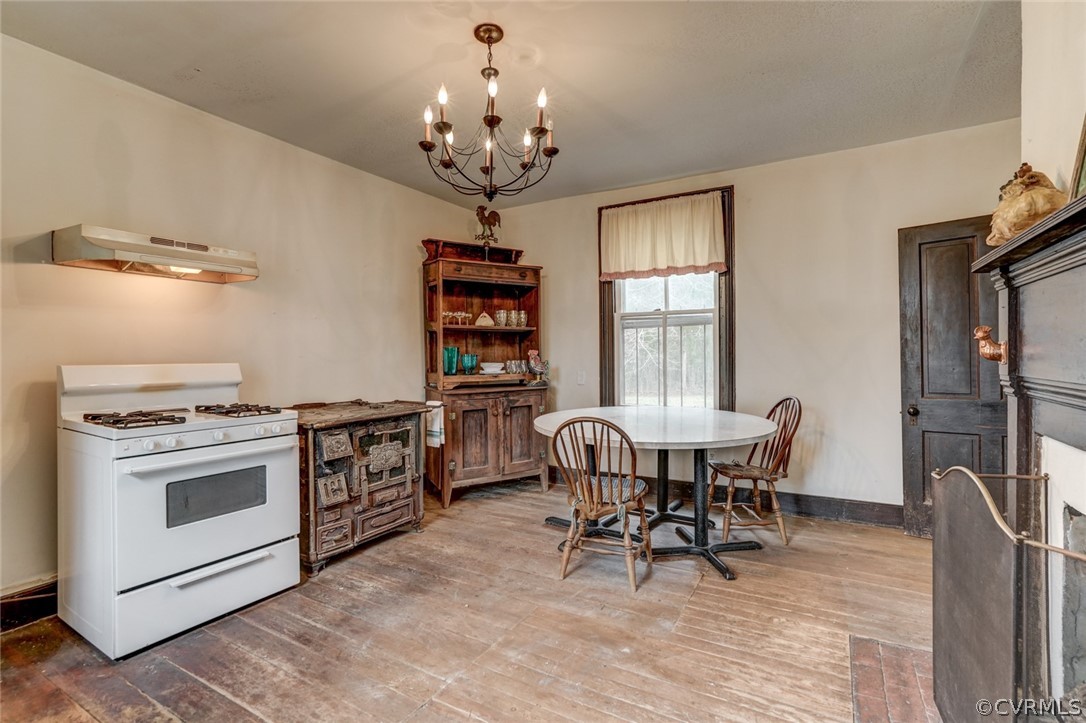 4625 Walton Road Louisa, VA 23093 - Photo 20 of 50 a view of a dining room with furniture and chandelier