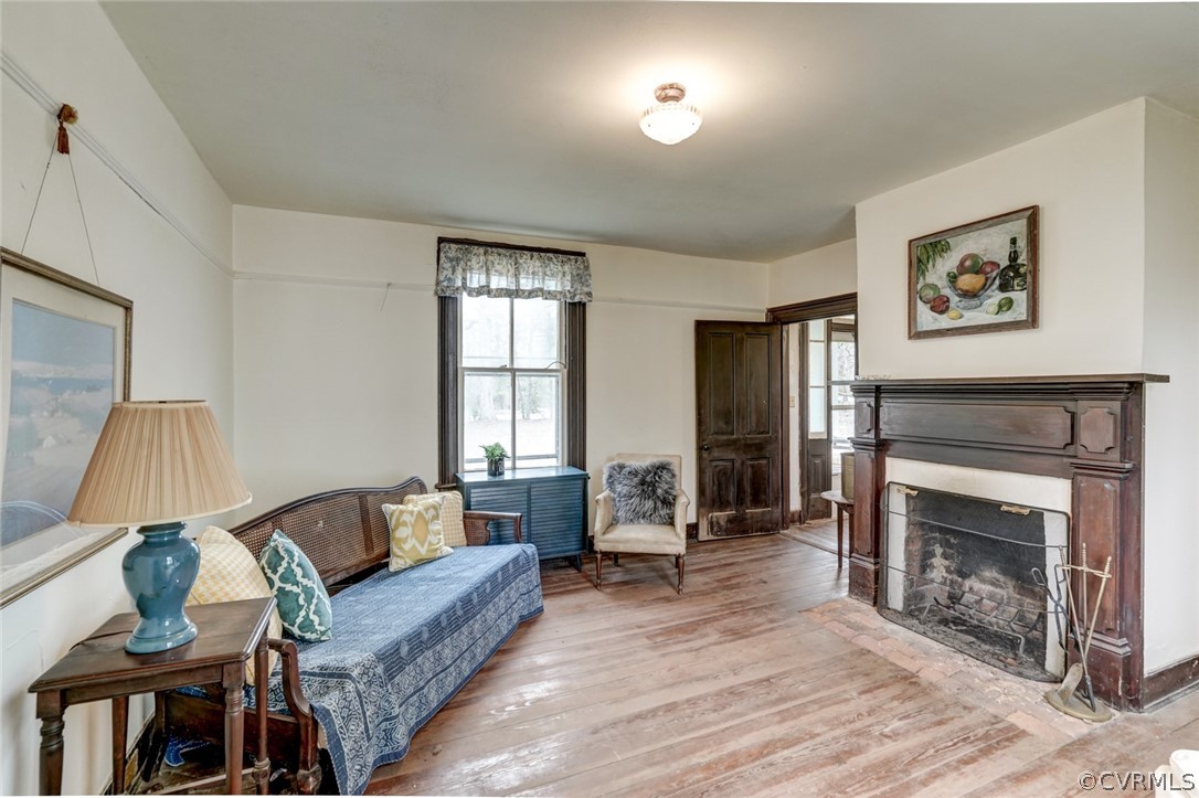 4625 Walton Road Louisa, VA 23093 - Photo 22 of 50 a living room with furniture and a fireplace