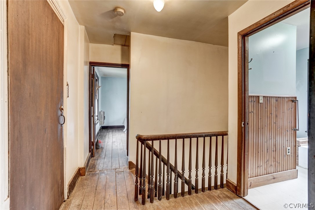 4625 Walton Road Louisa, VA 23093 - Photo 28 of 50 a view of a hallway with wooden floor and staircase