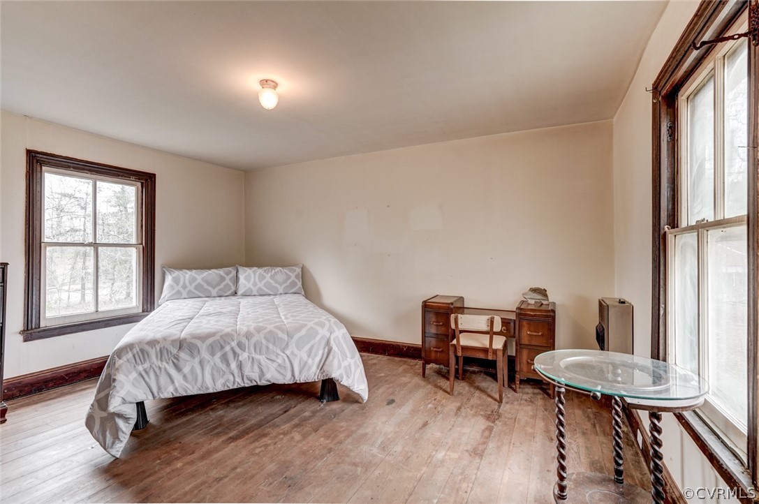 4625 Walton Road Louisa, VA 23093 - Photo 32 of 50 a bedroom with a bed a table and chair