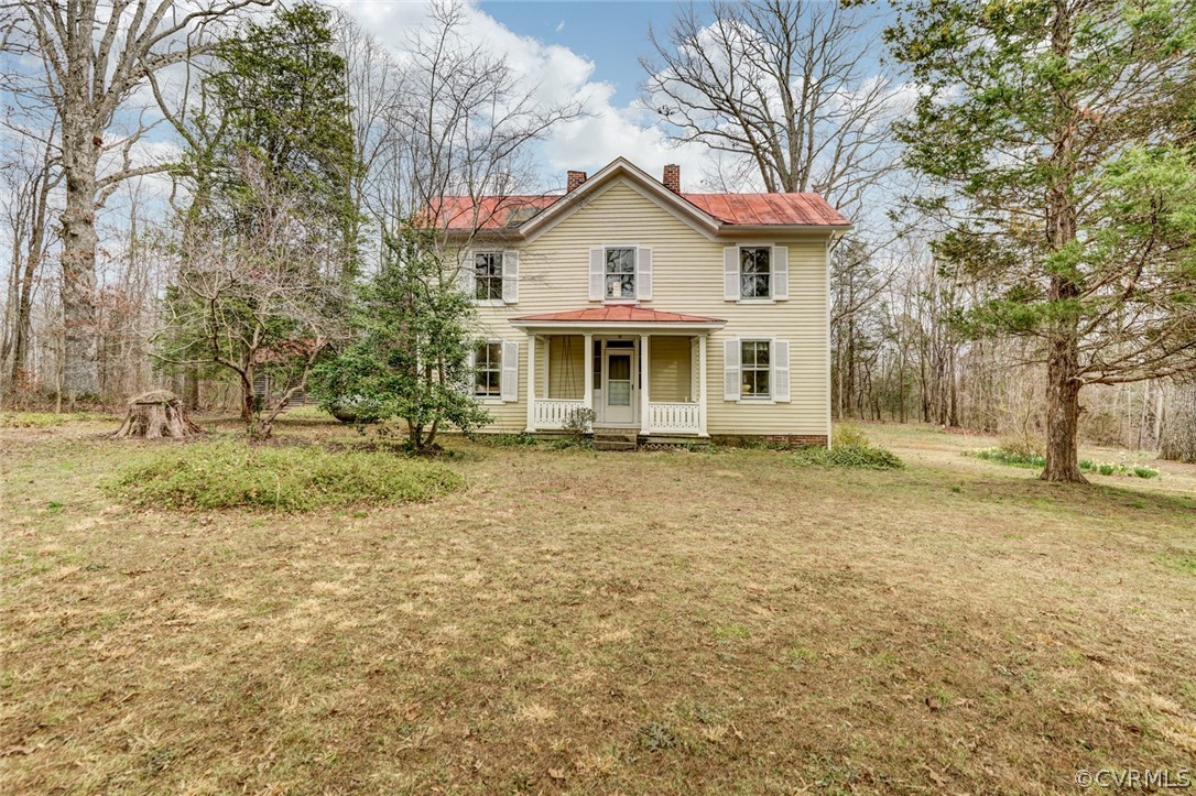 4625 Walton Road Louisa, VA 23093 - Photo 6 of 50 a front view of a house with a garden