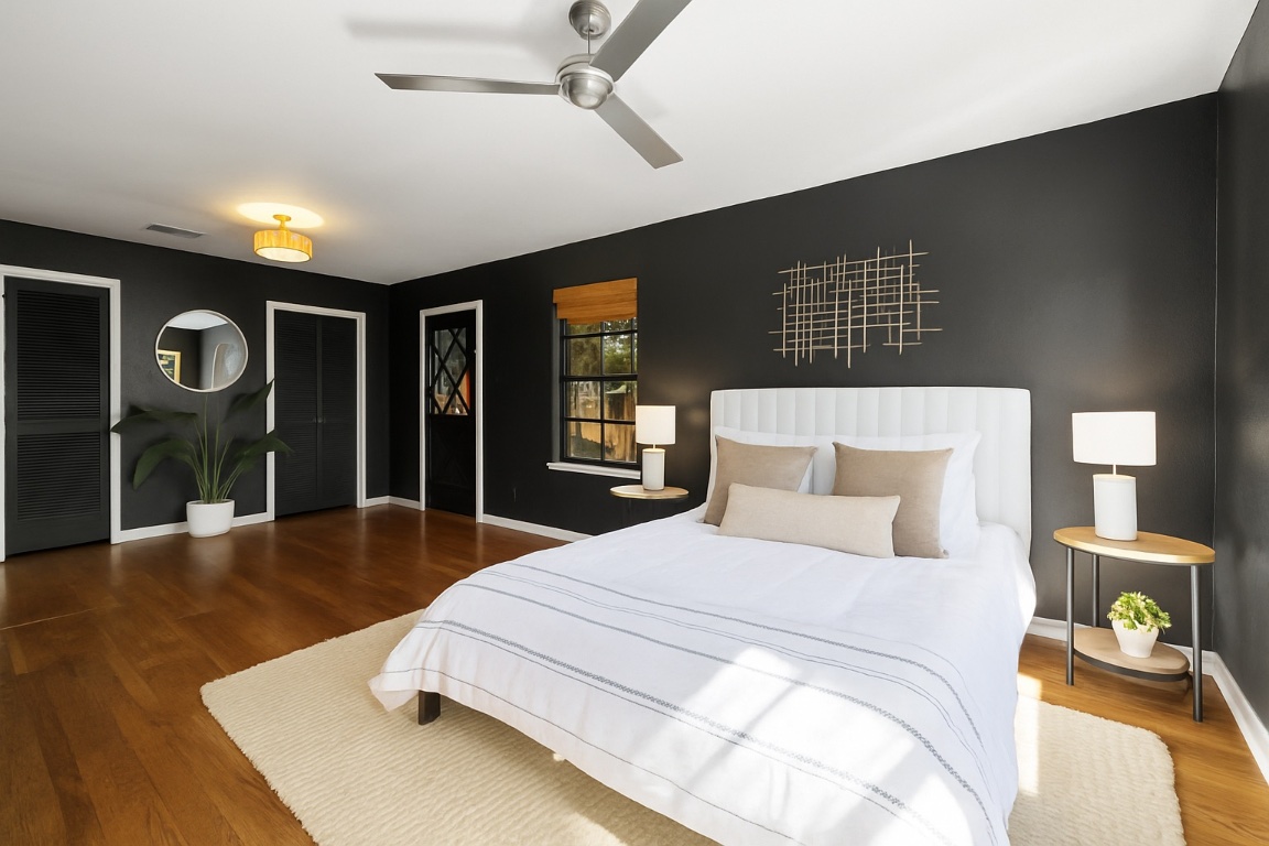 2008 Matthews Lane Austin, TX 78745 - Photo 20 of 36 a spacious bedroom with a bed and a table with wooden floor