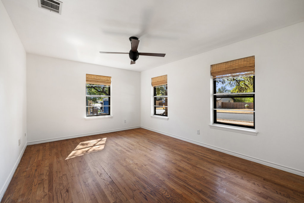 2008 Matthews Lane Austin, TX 78745 - Photo 24 of 36 a view of empty room with wooden floor and window