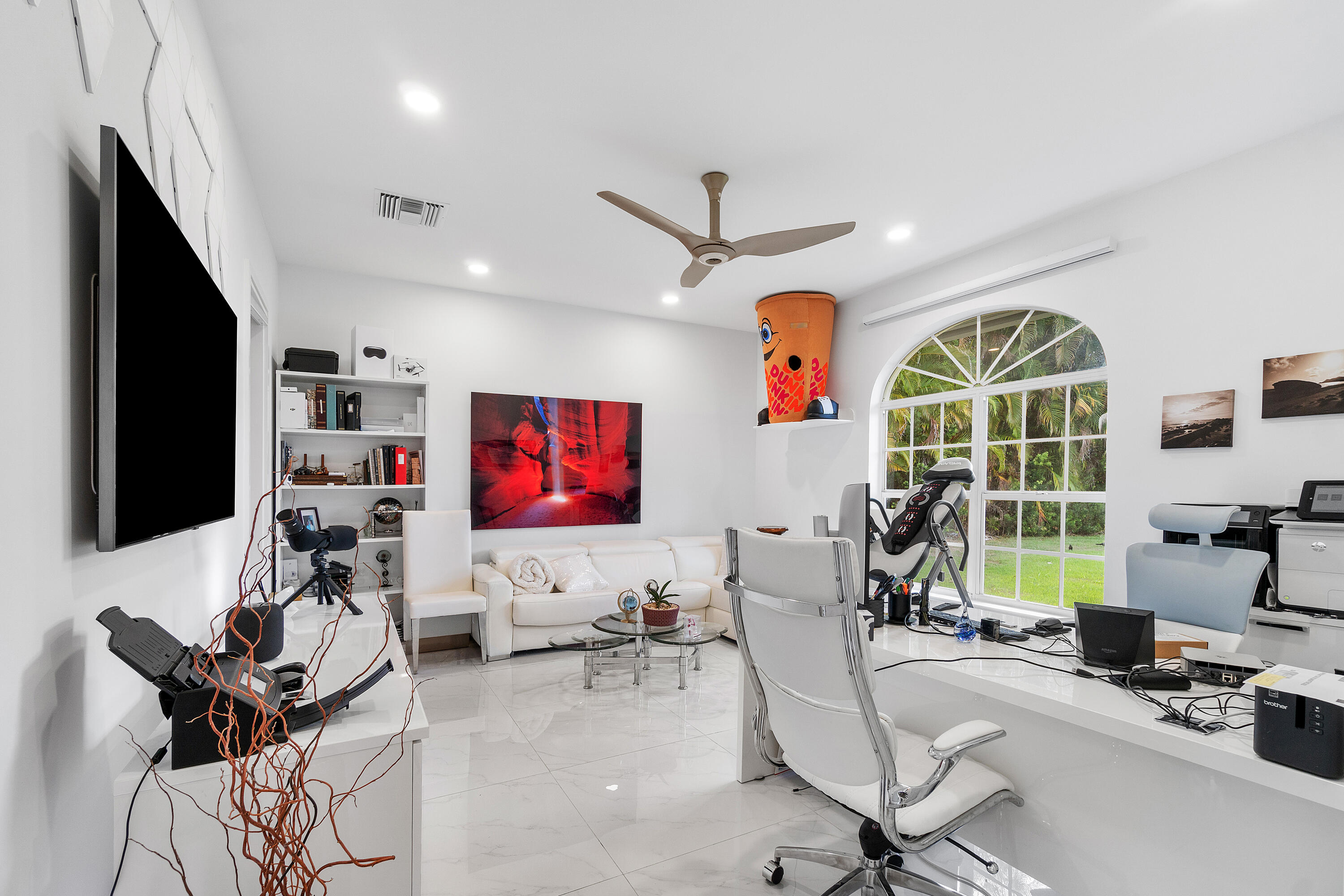 5447 Center Street Jupiter, FL 33458 - Photo 21 of 60 a living room with furniture and a flat screen tv