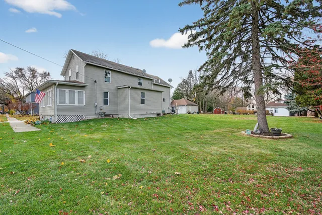a view of a house with a yard