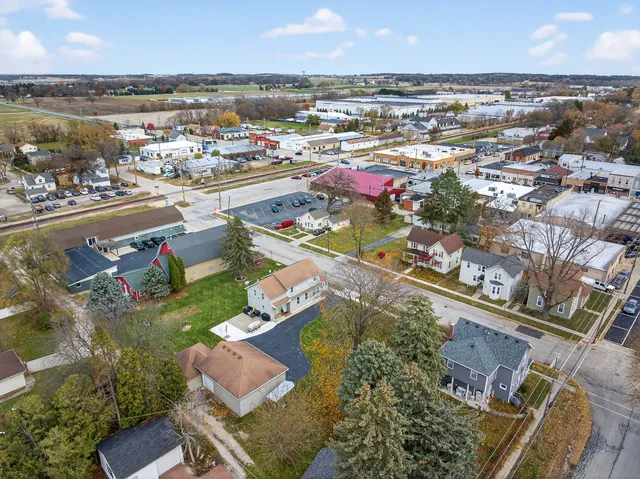 an aerial view of residential houses with outdoor space