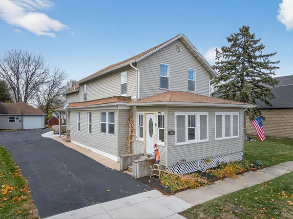 a front view of a house with a yard