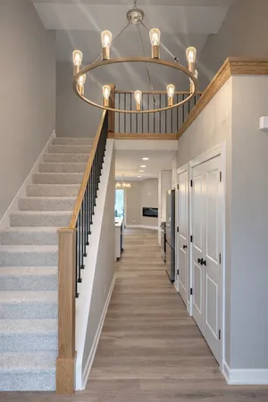 a view of entryway and hall with wooden floor