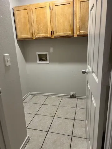 a view of a utility room with window