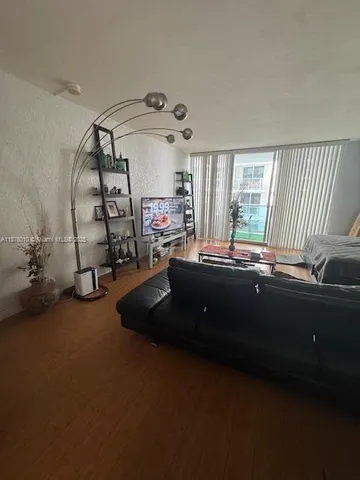 a room with furniture and a large window