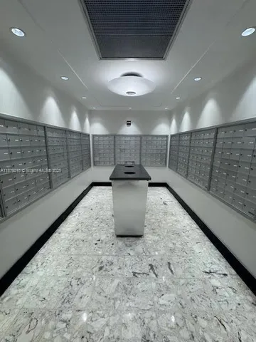 a lobby with furniture and large windows