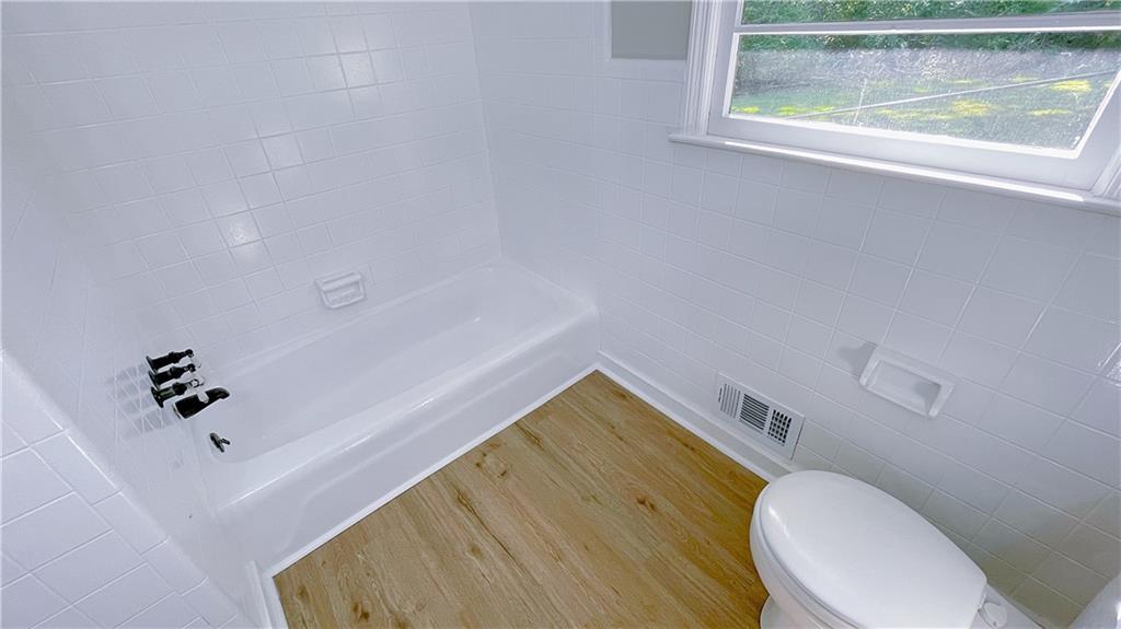 122 Barnesville Road Griffin, GA 30224 - Photo 14 of 19 a bathroom with a sink and a toilet