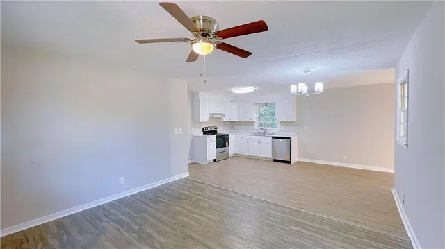 a view of a kitchen with a sink and a window