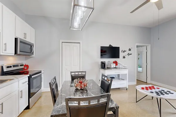 a bathroom with a sink vanity and a mirror