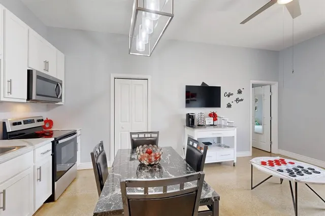 a bathroom with a sink vanity and a mirror