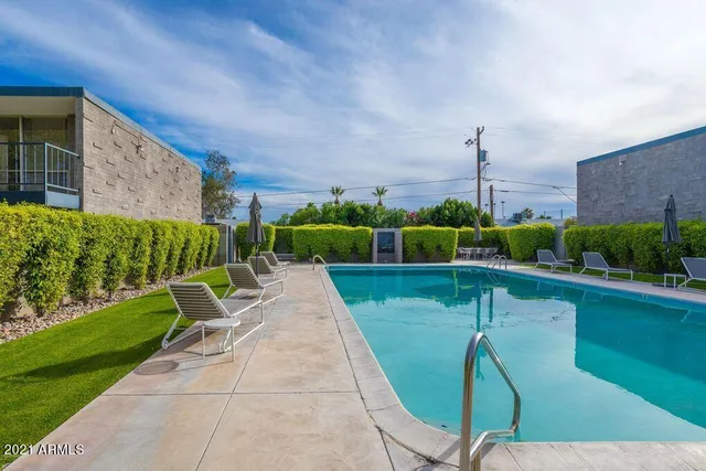 a view of a backyard with a table and chair