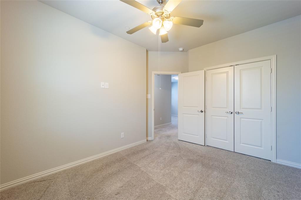 4666 Rhett Lane, Unit E Carrollton, TX 75010 - Photo 30 of 40 Spacious secondary bedrooms with generous closet space