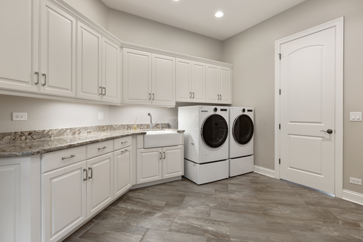 2-s291 Nelson Lake Road Batavia, IL 60510 - Photo 19 of 57 a utility room with sink dryer and washer